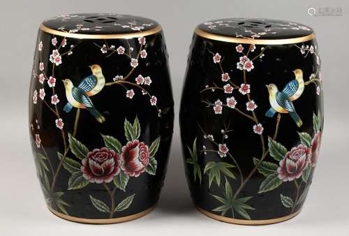 A PAIR OF BLACK CHINESE PORCELAIN BARREL SEATS with flowers ...