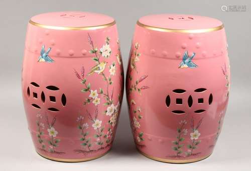 A PAIR OF PINK CHINESE PORCELAIN BARREL SEATS with flowers a...