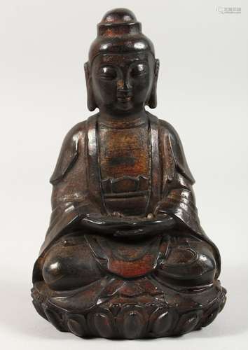 A CHINESE BRONZE SEATED GOD. 8ins high.