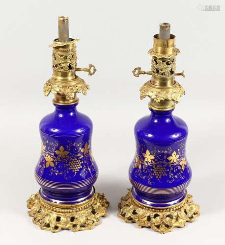 A GOOD PAIR OF 19TH CENTURY BLUE GLASS AND GILT METAL LAMPS ...