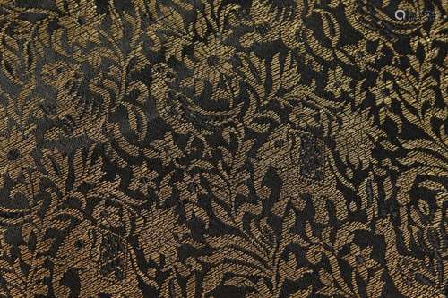 A BLACK AND GOLD DAMASK RUNNER. 13ft 2ins x 3ft.