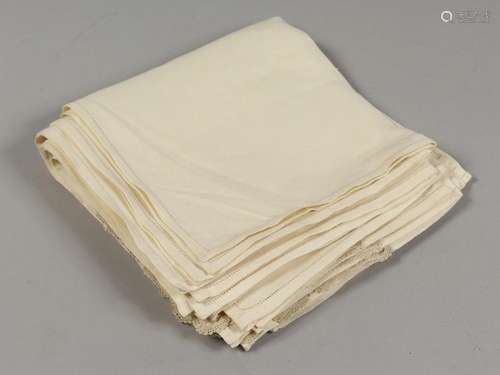 TWELVE CREAM NAPKIN CLOTHS.