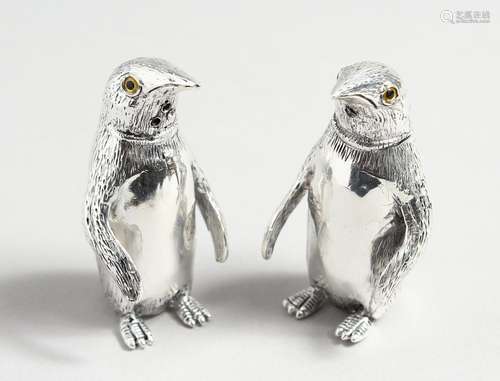 A PAIR OF .800 PENGUIN SALT AND PEPPERS.