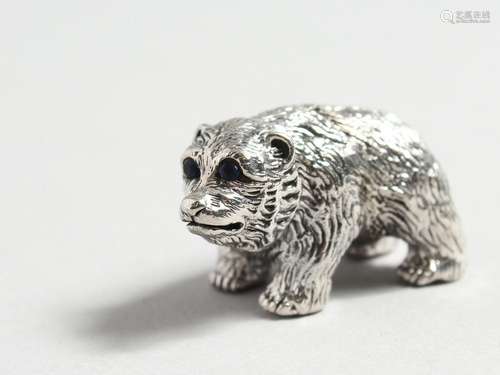 A CAST SILVER BEAR.