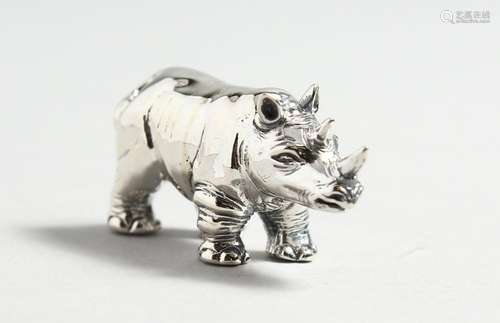 A CAST SILVER RHINO.