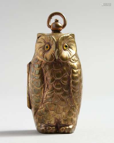 A BRASS DOUBLE SOVEREIGN OWL CASE.