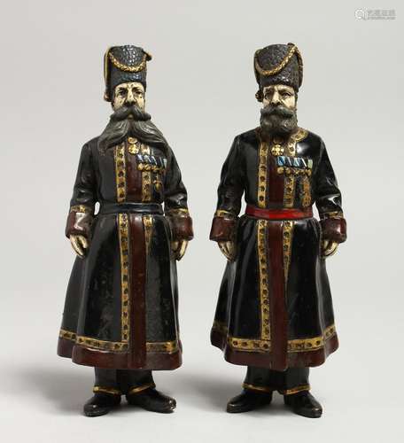 A GOOD PAIR OF RUSSIAN BRONZE FIGURES OF BEARDED MEN. 7ins