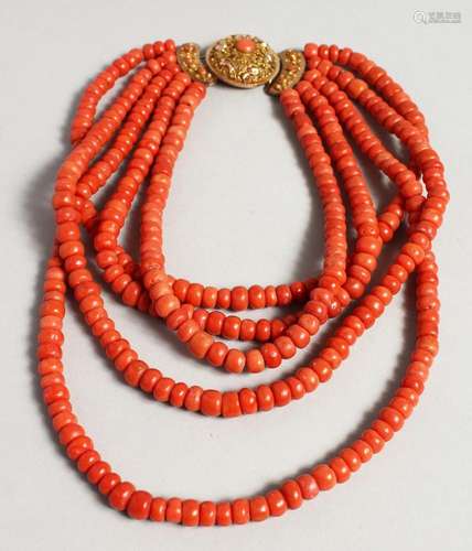 A SUPERB FIVE ROW CORAL NECKLACE with a gold clasp.