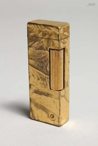 A MANS GILT DUNHILL LIGHTER, Swiss made.