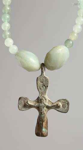 A ROMAN CAST IRON CROSS on bead necklace.