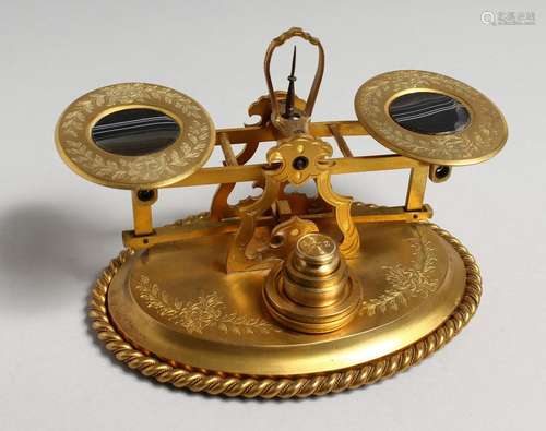 A GOOD SET OF ORMOLU SCALES AND WEIGHTS, the balances inset ...