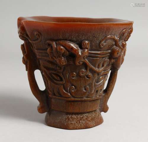 A CHINESE CARVED HORN LIBATION CUP. 5ins high.