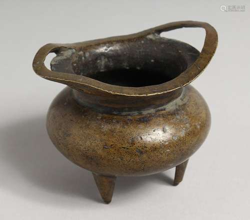 A CHINESE BRONZE TWO-HANDLED CENSER on three legs. Sixteen-c...