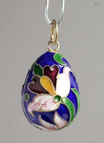 A RUSSIAN SILVER AND ENAMEL EGG PENDANT.