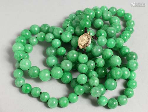 A DOUBLE ROW OF ONE HUNDRED AND TWENTY JADE BEADS with gold ...