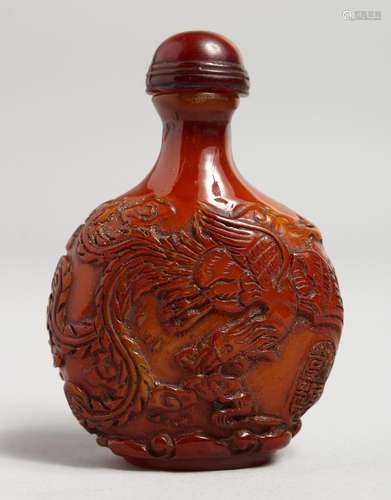 A CARVED AMBER SNUFF BOTTLE. 2.75ins.