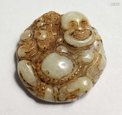 A CHINESE CARVED JADE ROUNDEL, BUDDHA. 1.75ins.