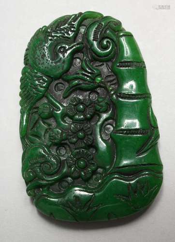 A LARGE CHINESE CARVED JADE PENDANT. 3.5ins x 2ins.