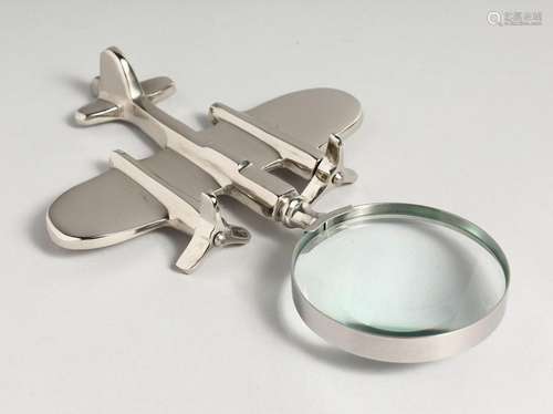 A NOVELTY NICKEL AEROPLANE MAGNIFYING GLASS.