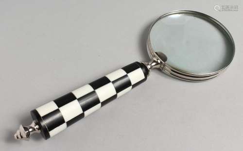 A NOVELTY MAGNIFYING GLASS with chequered handle.