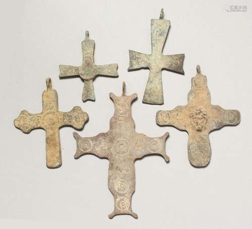 FIVE MEDIUM ROMAN CAST IRON CROSSES.