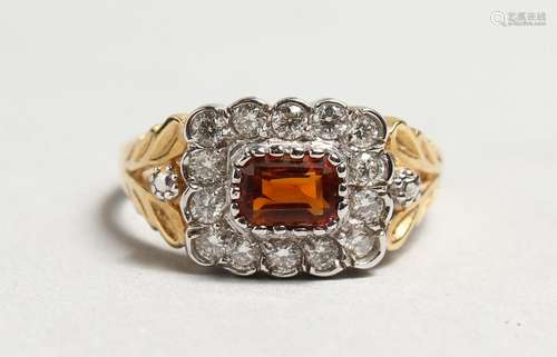 A GOOD 18CT GOLD, CITRINE AND DIAMOND RING.