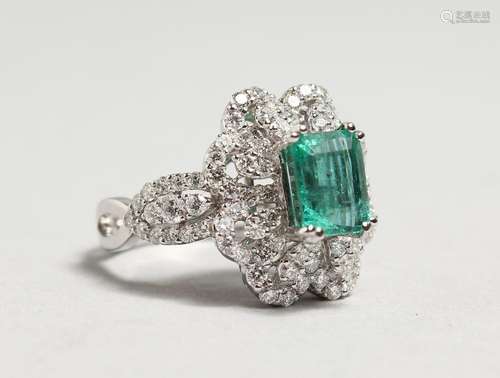 A GOOD 18CT GOLD, 2.40CT EMERALD AND DIAMOND RING.