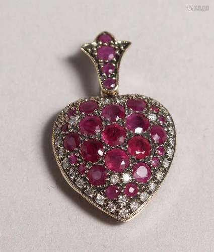 A GOOD 9CT GOLD, RUBY, AND DIAMOND HEART SHAPED LOCKET.