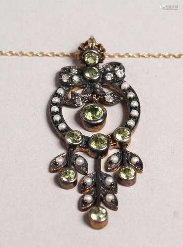 A 9CT GOLD AND SILVER SET PERIDOT AND PEARL PENDANT on chain...