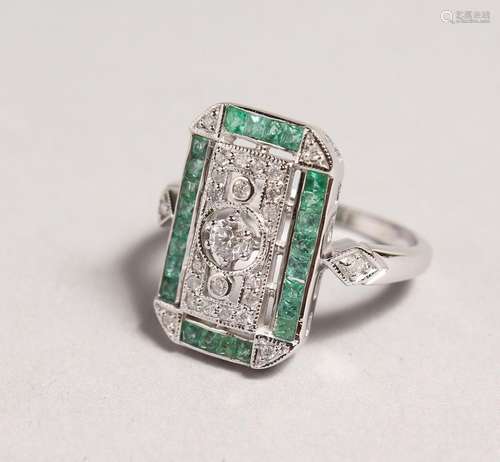 A 9CT GOLD, EMERALD, AND DIAMOND DECO STYLE RING.