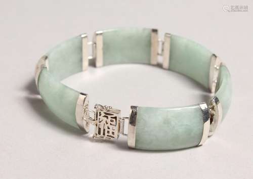 A CHINESE SILVER AND JADE BRACELET.