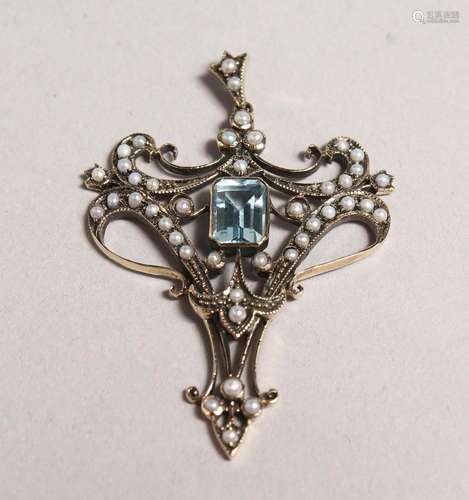 A 9CT GOLD BLUE TOPAZ AND PEARL PENDANT AND CHAIN.