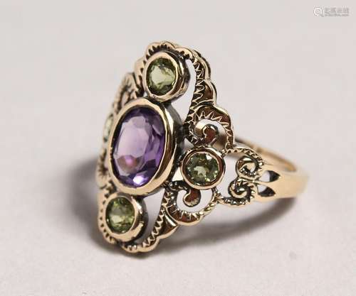 A 9CT GOLD, PERIDOT AND AMETHYST RING.