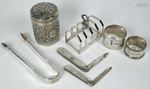 Silver toast rack, tongs, penknives, etc.