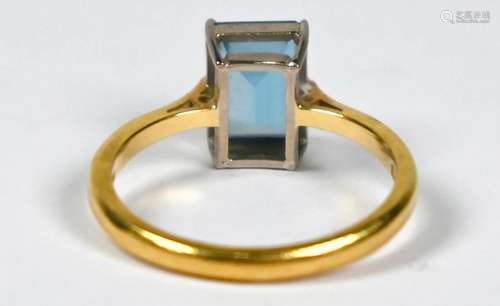 A rectangular blue topaz ring