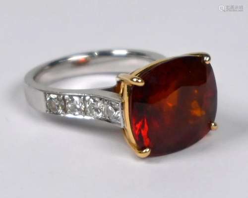 A garnet and diamond set dress ring