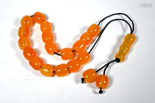 A row of amber-coloured beads