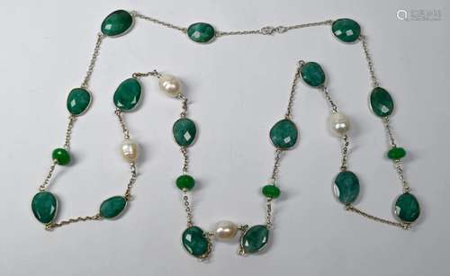 A long necklace formed of mixed emeralds and baroque