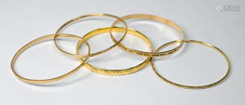 Five various 9ct yellow gold bangles