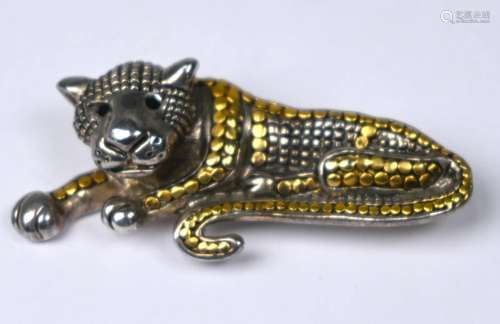 A brooch in the form of a reclining leopard