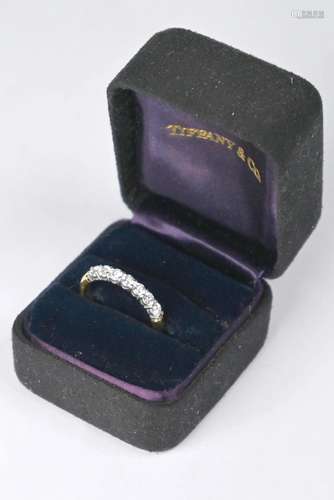 A Tiffany & Co seven stone diamond half eternity ring