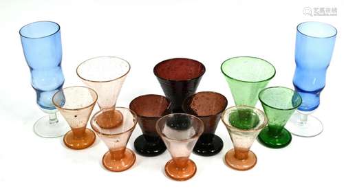 Three North African conical coloured soda-glass beakers