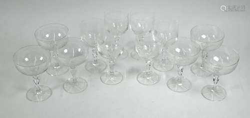 A set of six champagne saucers and matching wine