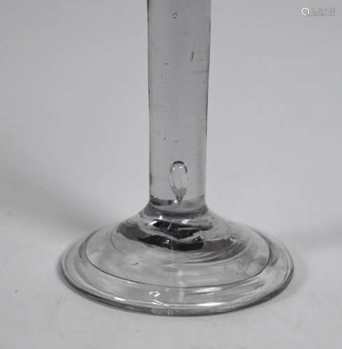 An antique cordial glass with flared conical bowl