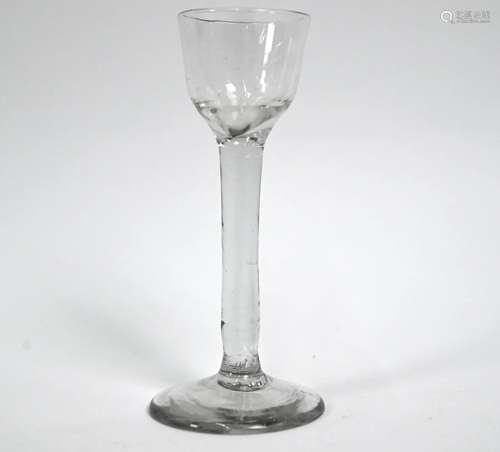 An antique cordial glass