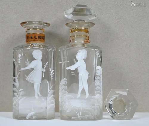 A pair of cut glass scent bottles and stoppers