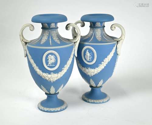 A pair of Edwardian Wedgwood pale blue Jasper urns