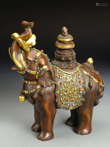 A QING DYNASTY BRONZE GILT INLAYED TREASURE ELEPHANT ORNAMEN...