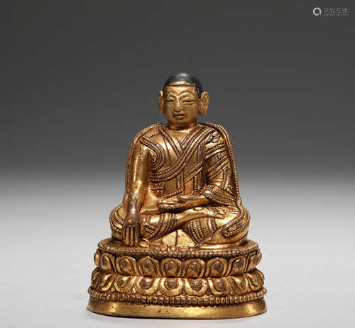 A QING DYNASTY BRONZE GILT MASTER STATUE