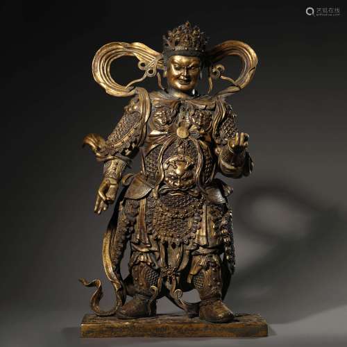 A MING DYNASTY BRONZE GILT HEAVENLY KING STATUE